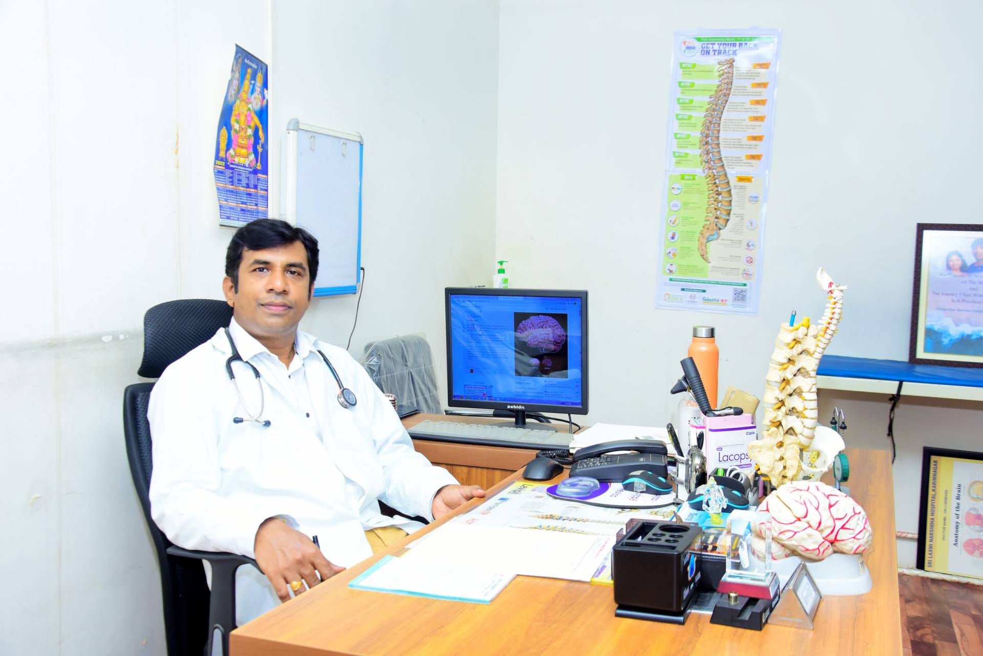 Portrait of Dr. J. Srinivas, an expert neurosurgeon specializing in advanced cranial and spinal procedures